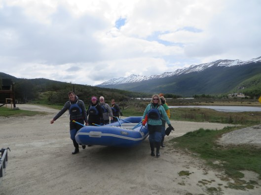 Pulling our canoe/white water raft towards the water.  I was so confused about what we were doing!