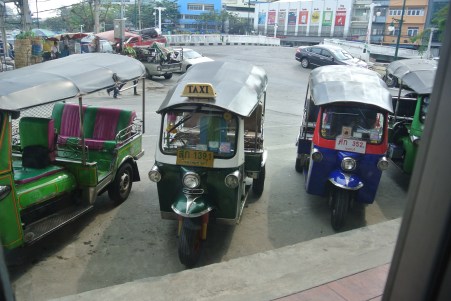 A line of 'tuk-tuks' waiting outside one of the many stops along the way.