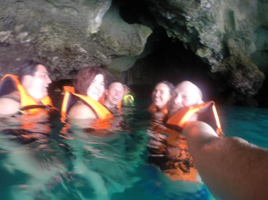 We swam through complete darkness for about 10 minutes until it opened up into a small, secluded lagoon.  These are our new friends from Chicago attempted to take a group selfie of us all.